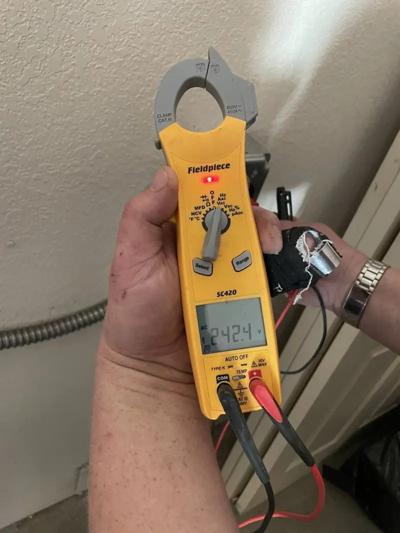 Voltage testing with clamp meter during Circuit Breaker Repair in Sudbury